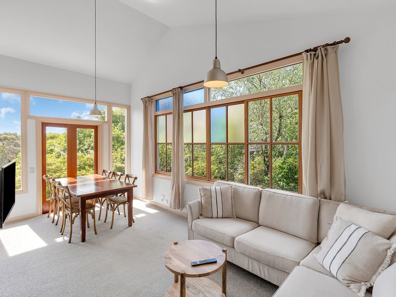 Light filled living and dining room with views of the National Park