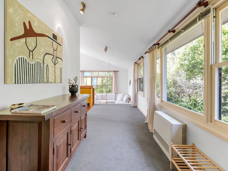 Light-filled hallway with serene views along the windows.