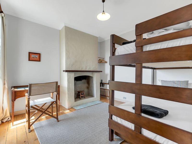 Bunk room with natural timber finishes.