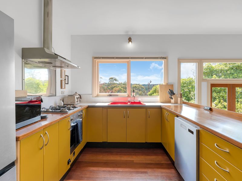 Spacious kitchen with ample bench space and bright views.