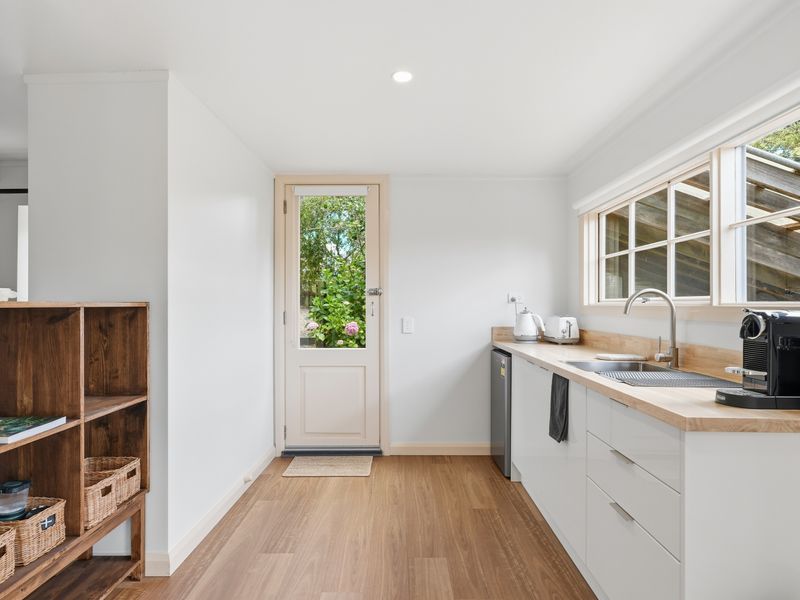 Modern kitchen with direct access to the outdoors.