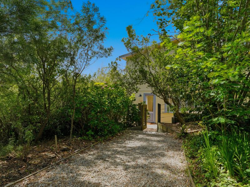 Leafy garden pathway leading to the home, offering full privacy and tranquillity.