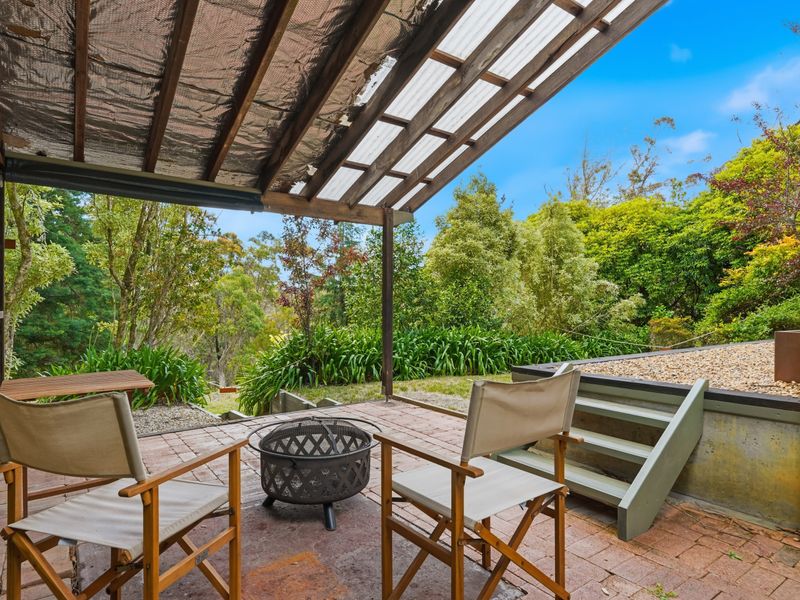 Inviting outdoor patio overlooking lush greenery—perfect for relaxing.