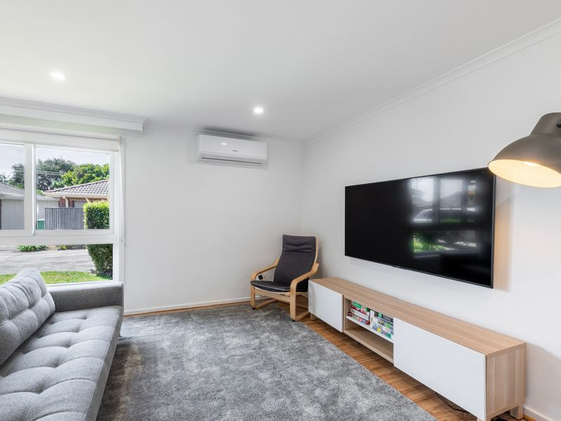 Cozy living room with smart TV and comfy seating