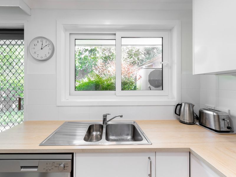 Bright kitchen with garden views