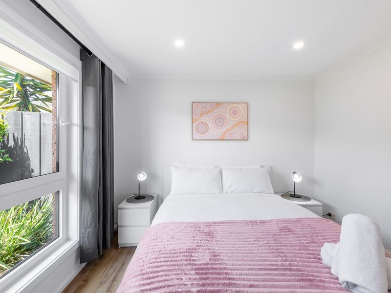 Garden-facing bedroom with fresh linens