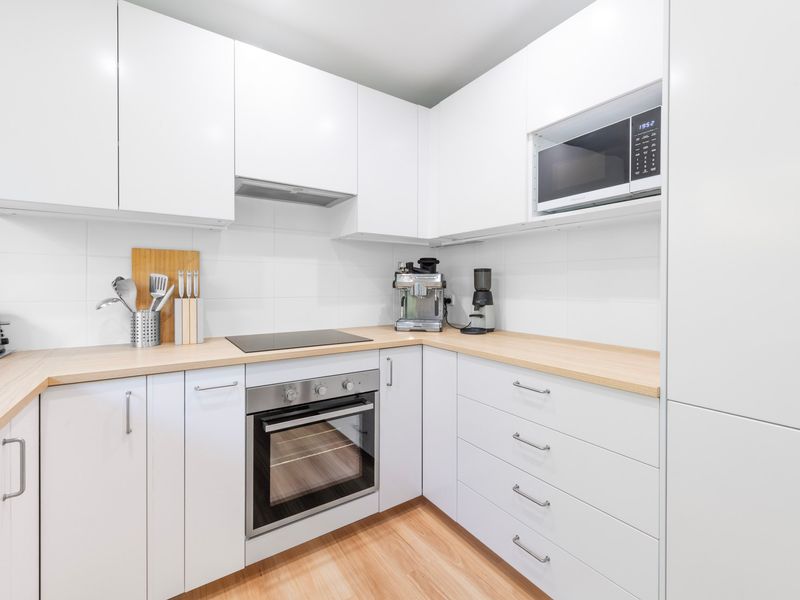 Sleek, fully equipped kitchen ready for home-cooked meals