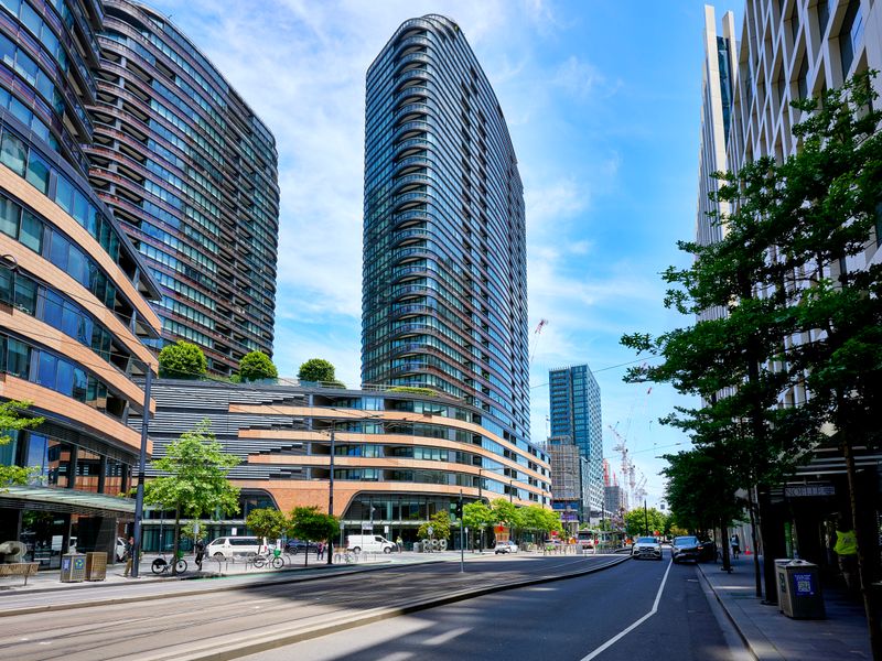 Vibrant street frontage surrounded by modern city architecture and amenities.