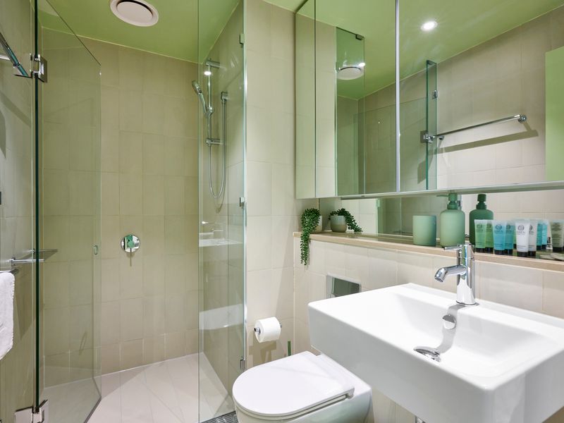 Bright, modern bathroom with sleek finishes and a spacious walk-in shower.