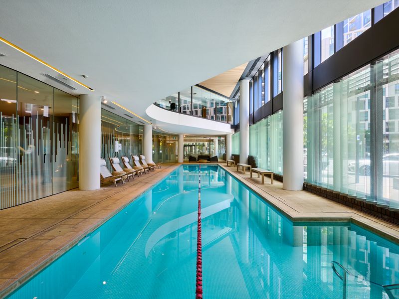 Luxurious indoor lap pool with hotel-style facilities for guest use.