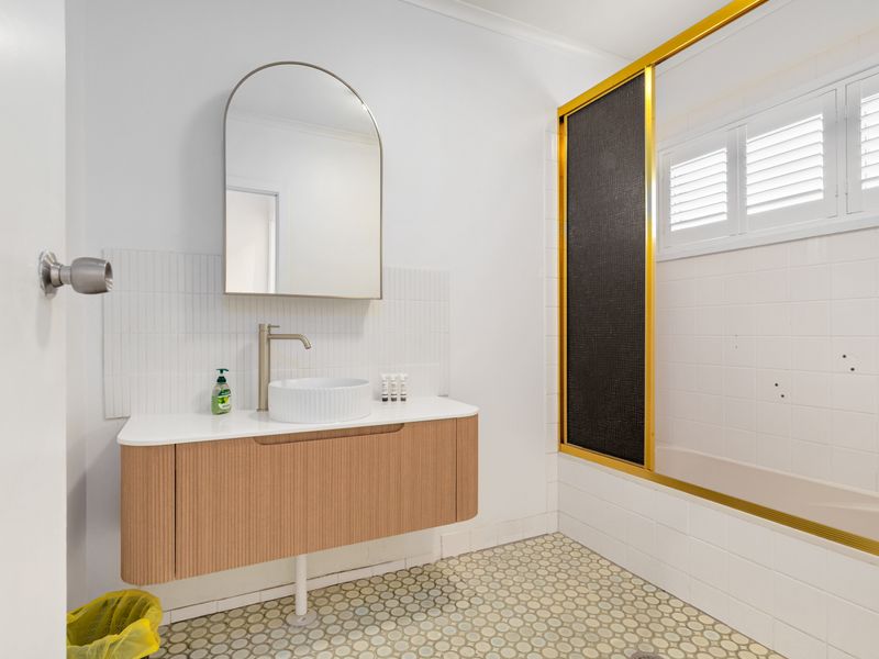 Stylish bathroom with modern vanity and mirror
