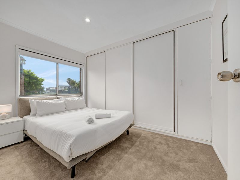 Cozy bedroom with natural light and ample storage