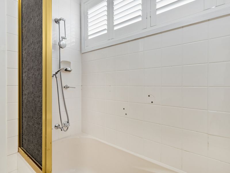 Spacious shower with sleek, contemporary design