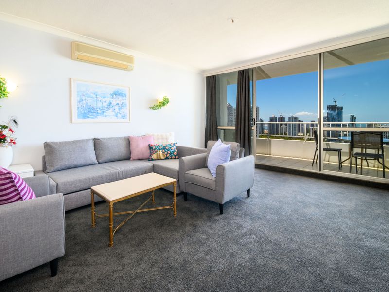 Open living space with balcony views over the city.