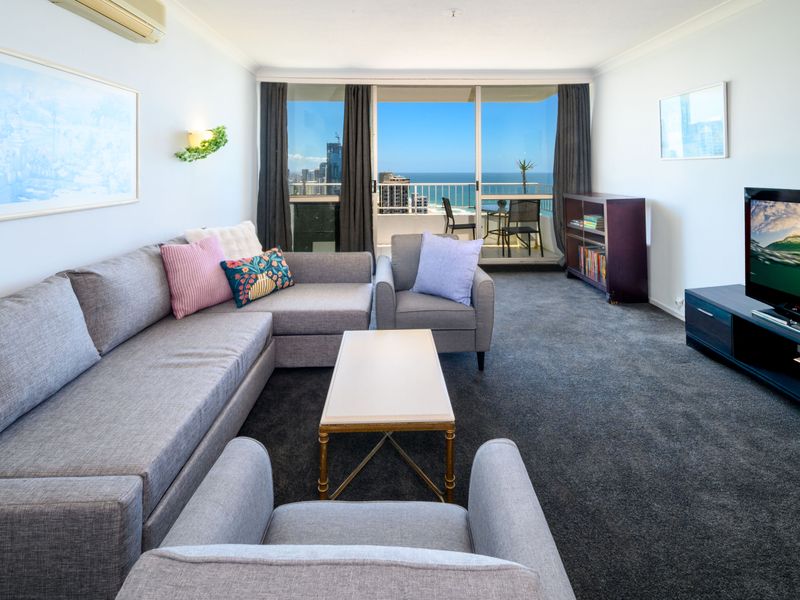 Cozy lounge setup with soft carpeting and natural light.