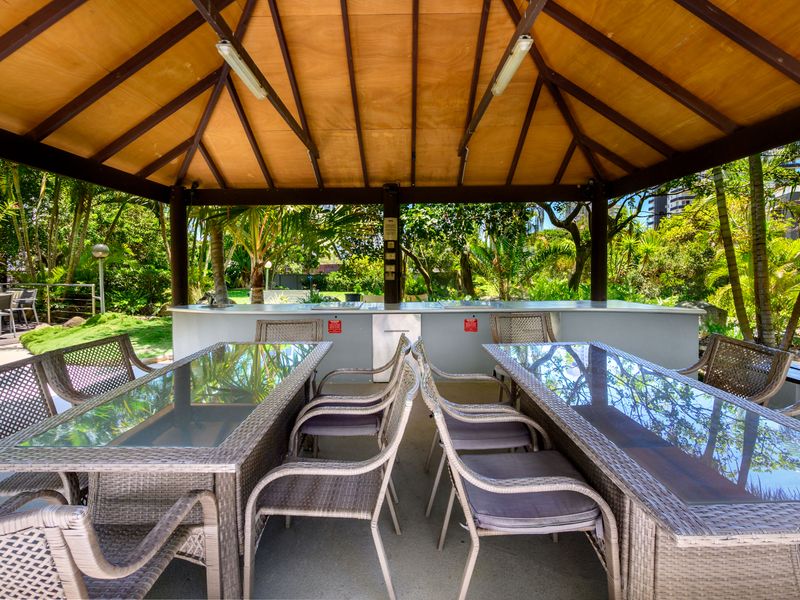 Covered outdoor seating area ideal for relaxing in the shade.