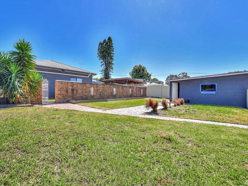 Spacious outdoor area with sunny green space