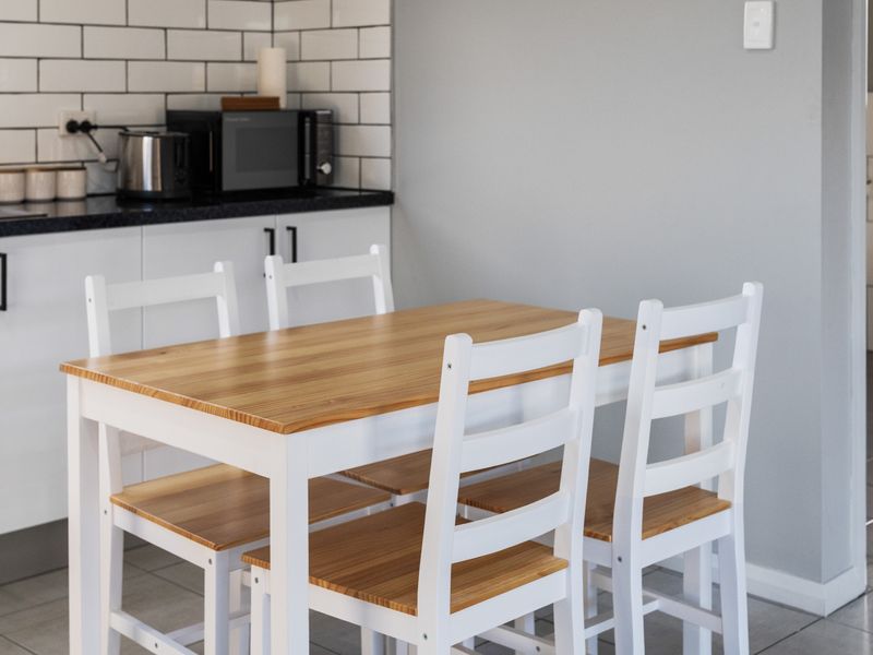 Dining space for four, perfect for meals, work or planning your day.