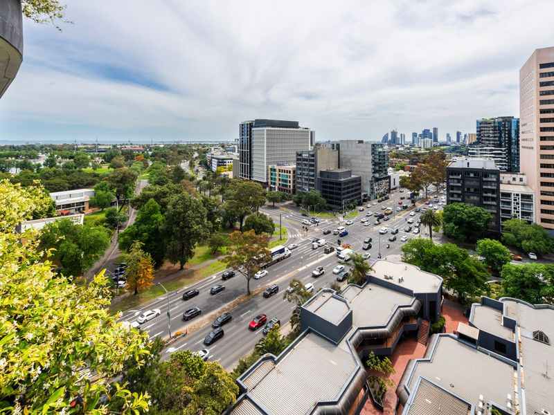 Elevated outlook with greenery and skyline in the distance.