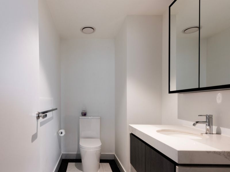 Clean and bright powder room with simple, functional design.