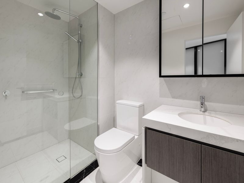 Sleek walk-in shower with modern fixtures.