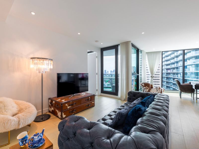 Stylish lounge area with comfortable seating and large windows.