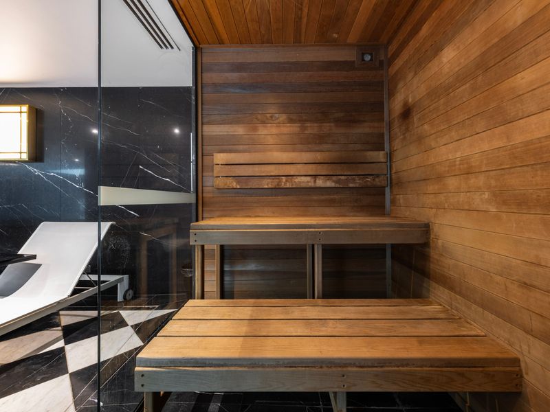 Timber-lined sauna offering a soothing wellness experience.