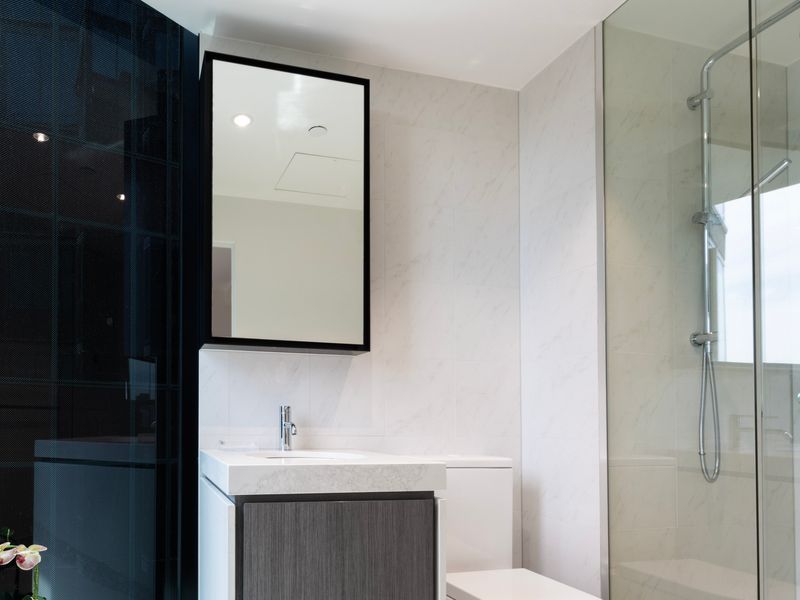 Bright ensuite-style bathroom with a walk-in shower.