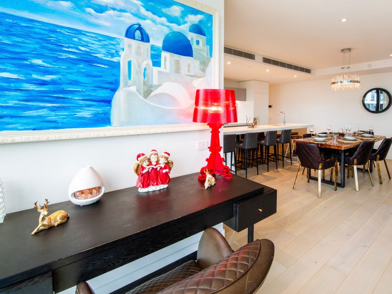 Dining area with statement artwork and vibrant décor accents.