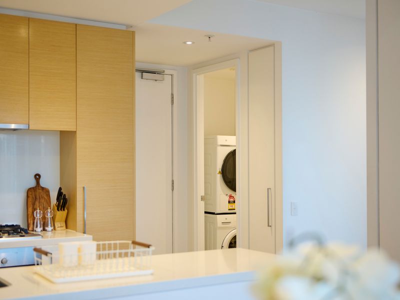 Bright hallway leading to bedrooms and living areas