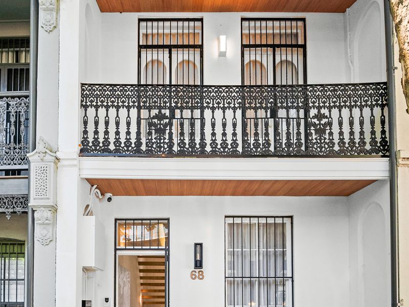 Detailed exterior balcony with classic iron balustrade
