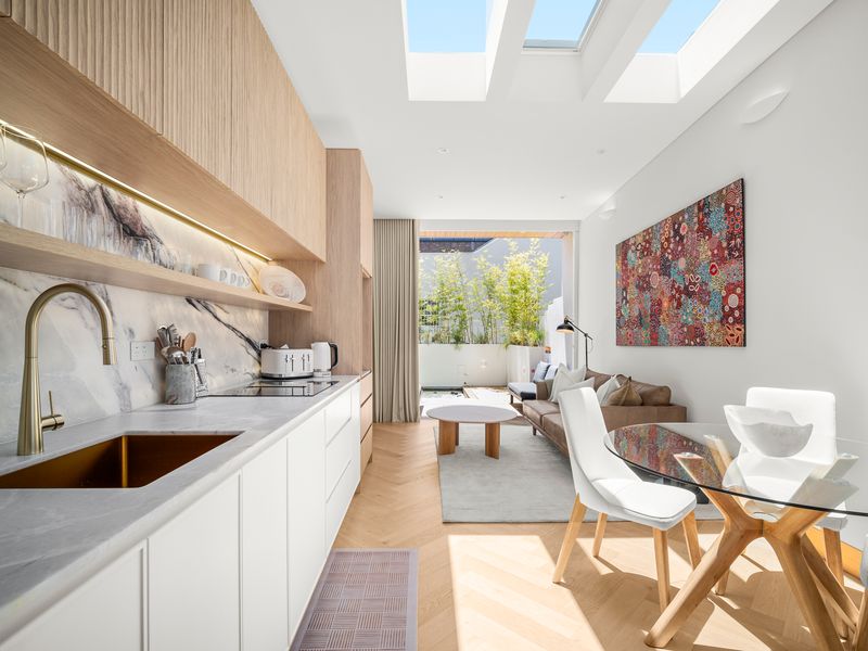 Modern open kitchen and dining space filled with natural light