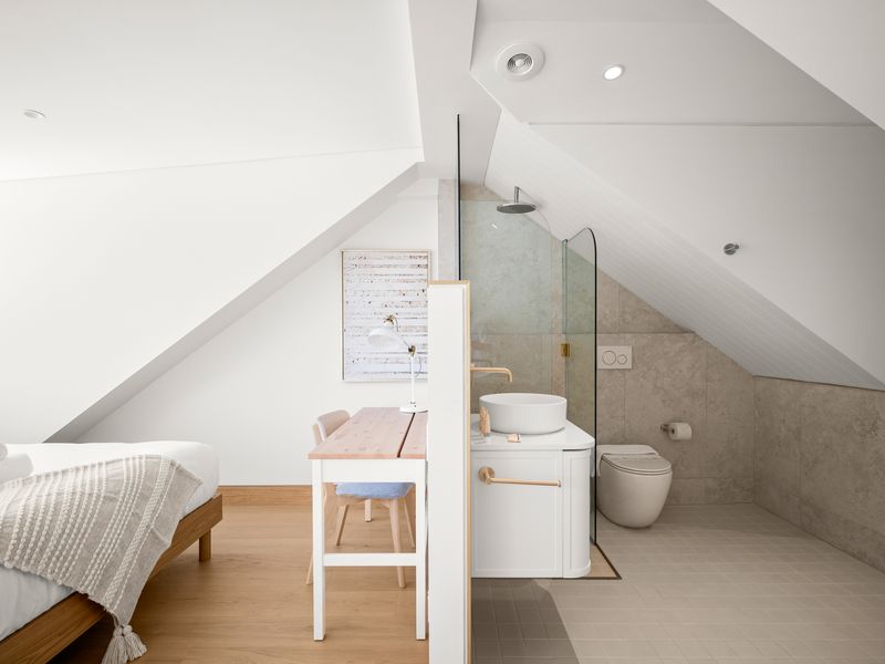 Attic ensuite bathroom with walk-in shower and toilet