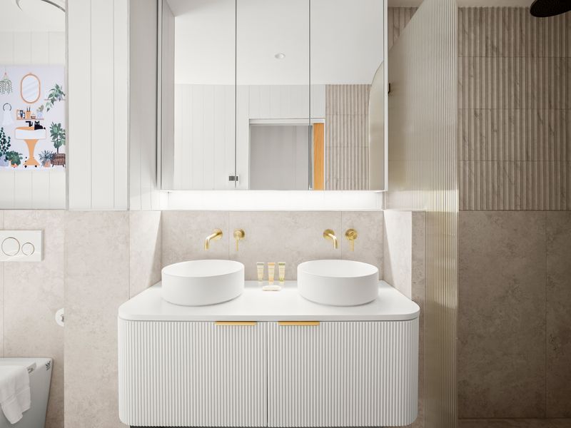 Modern double vanity with sleek fixtures and hotel-inspired finishes