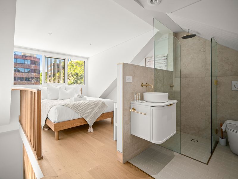Bedroom with ensuite bathroom and natural light