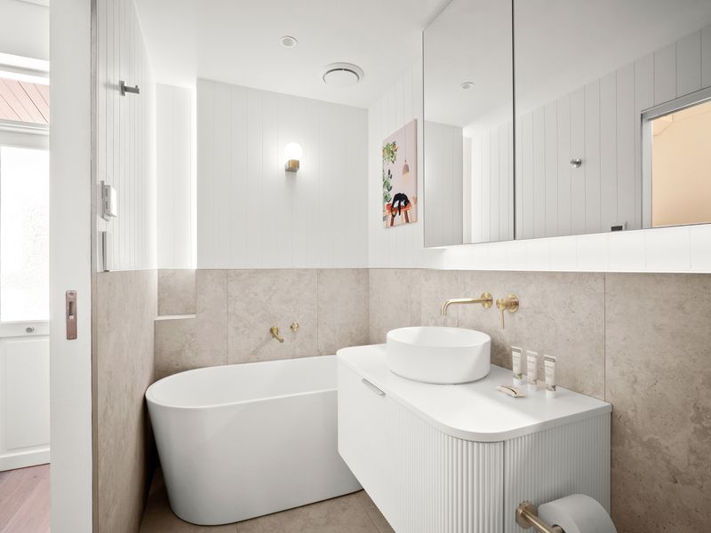 Stylish bathroom with freestanding bathtub and vanity