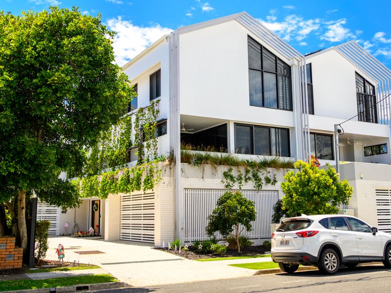 Modern exterior architecture with clean lines and lush surroundings.