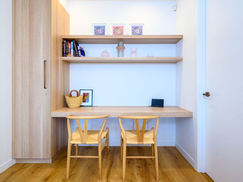 Dedicated workspace with shelving—perfect for remote work or study.