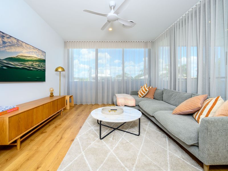 Inviting living room with comfy seating and soft natural light.
