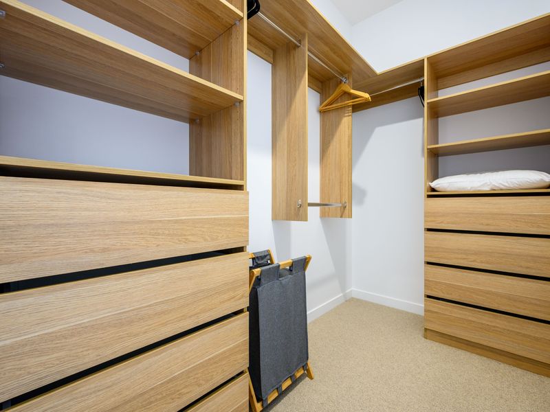 Spacious walk-in wardrobe with ample storage for extended stays.
