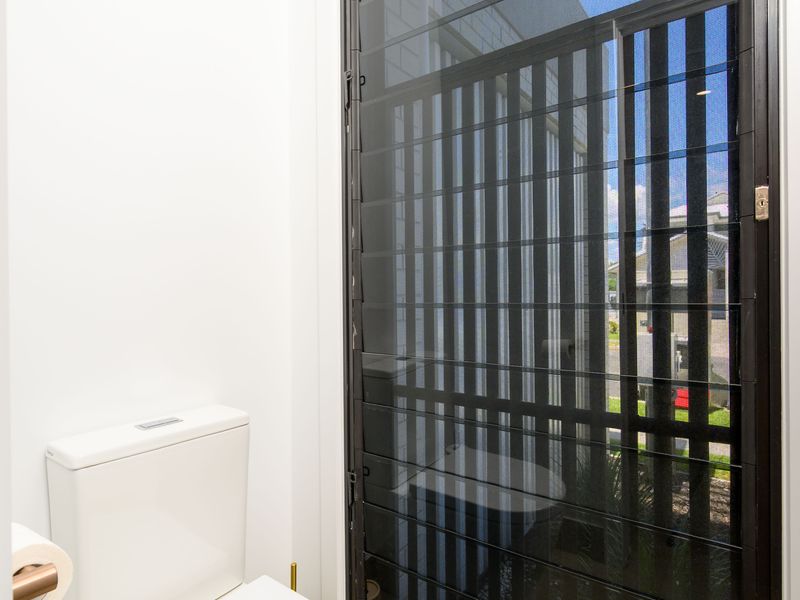 Clean and modern toilet space with natural light