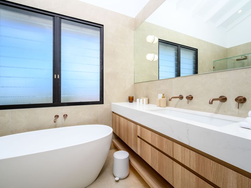 Spa-style bathroom with double vanity and a calming neutral palette.