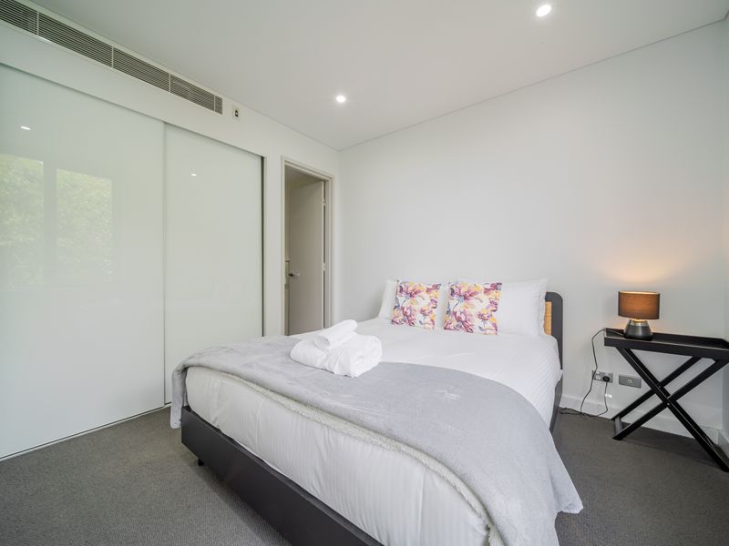 Freshly prepared bed with crisp white linens