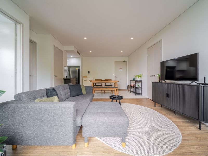 Relaxing lounge with cozy seating and smart TV