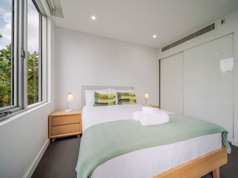 Bright bedroom with large windows