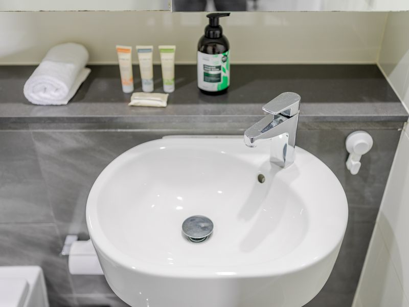 Fresh, modern bathroom with complimentary toiletries