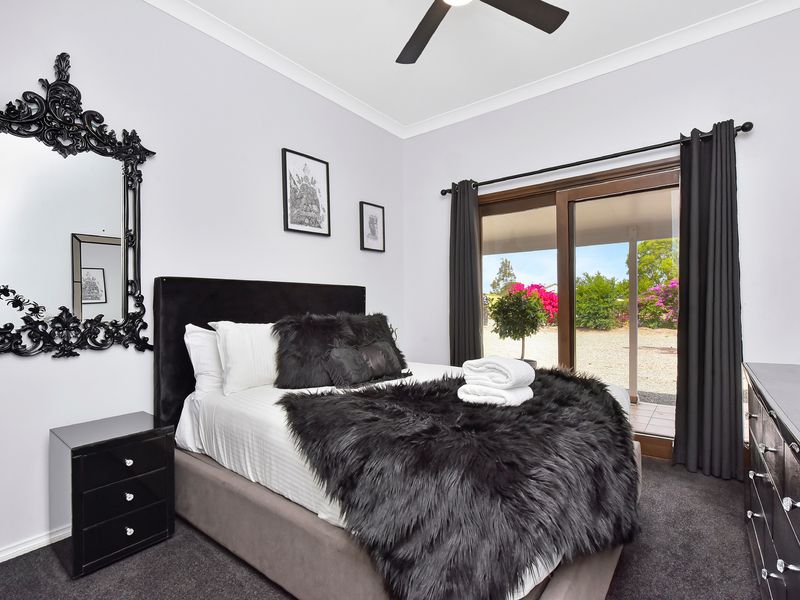 Cozy second bedroom styled with luxe accents and warm natural light