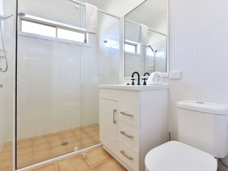 Clean, modern bathroom with walk-in shower