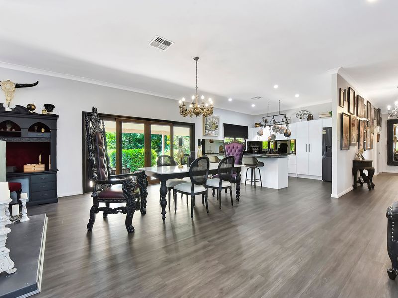 Light-filled dining area overlooking lush greenery.