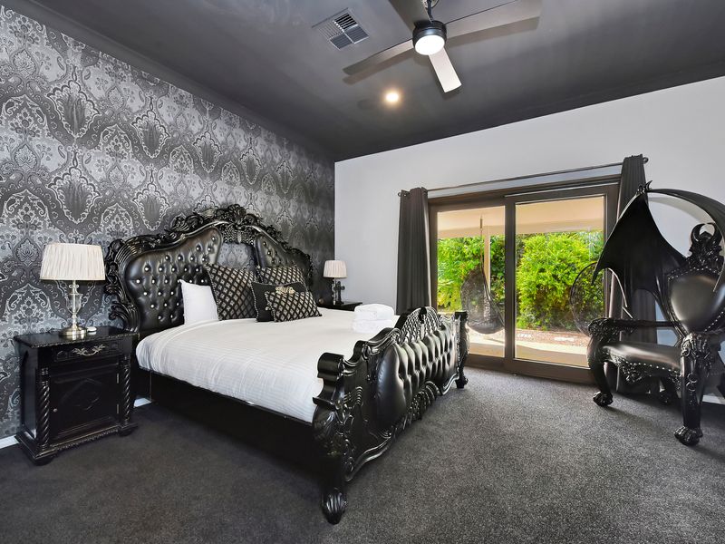 Luxurious bedroom with bold design and plush bedding.